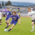 Sequims Max Stanford battles North Mason in Sequim with teammate Colton Wagner in on the play. (Emily Matthiessen/for Peninsula Daily News)