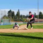 Port Angeles Carston Seibel slides home on a wild pitch to score against Orting at Civic Field on Friday. (Pierre LaBossiere/Peninsula Daily News)