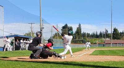 Port Angeles Bryce DeLeon hits a two-run double against Orting. (Pierre LaBossiere/Peninsula Daily News)
