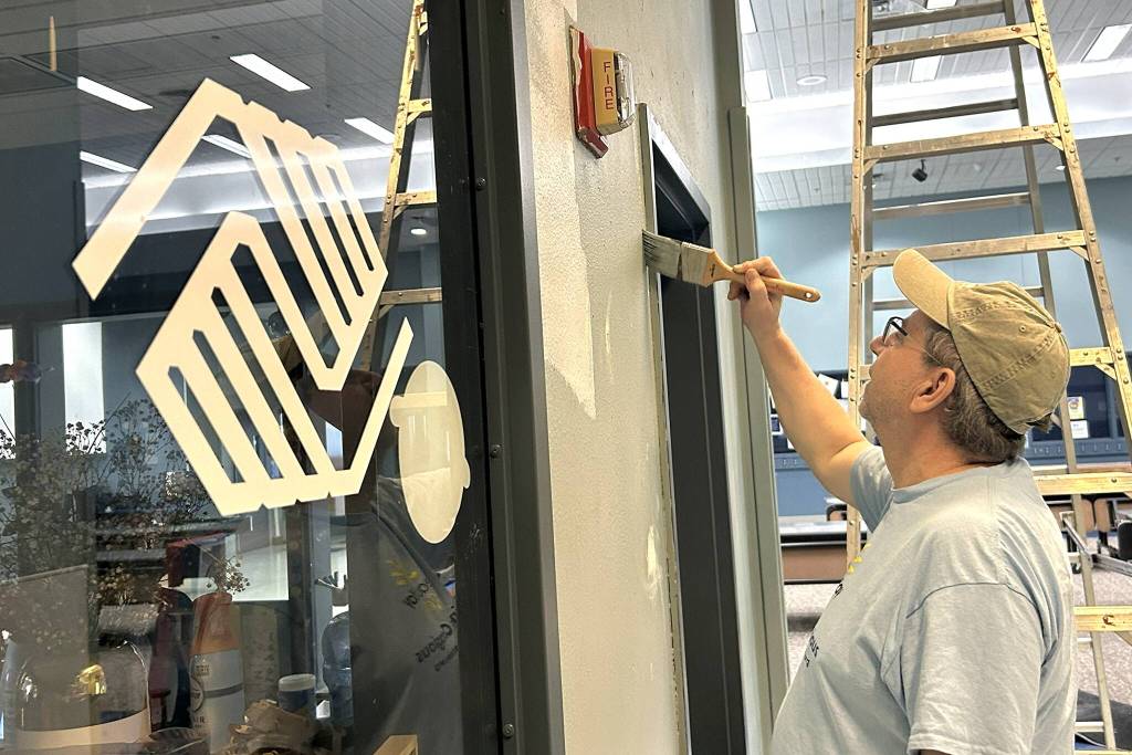 Brian Holden of Sequim Community Church helps paint near the Sequim Boys & Girls Clubs bathrooms during Sequim Beautiful Day. He assisted Sequim Valley Foursquare volunteers during the project. Service work is great, he said. I love to help. (Matthew Nash/Olympic Peninsula News Group)