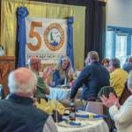 Sue Baden, commodore of the Sequim Bay Yacht Club, speaks to a crowd of 109 members at the 50th anniversary celebration on April 10 in the Hendricks Room at John Wayne Marina. (Emily Matthiessen/for Olympic Peninsula News Group)