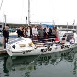 The Row West team and their families pray before beginning the voyage to Hawaii. (Pat Neal/For Peninsula Daily News)