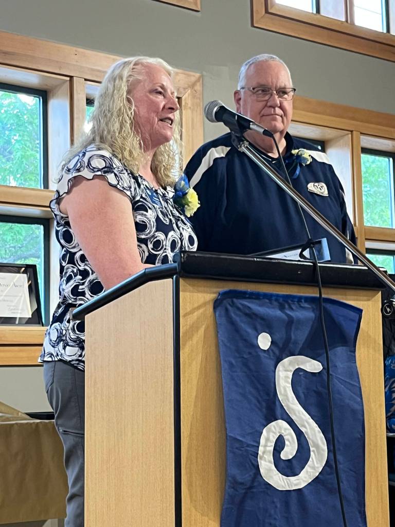 Carla Sue, left, provides remarks along with her husband, Dave Sue, after they were both honored with a Clallam County Community Service award on Wednesday at the Port Angeles Senior & Community Center. (Cynthia Evans)