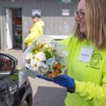 Emily Matthiessen/for Olympic Peninsula News Group
The communitys support of the Sequim Food Bank is evident in other ways besides donations of money and food. Here, volunteer Marilyn Pulk offers a bouquet of flowers donated by a local grocery store to a food bank client.