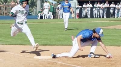 Port Angeles Bryce DeLeon gives a great effort to try to beat out a hit but the Bremerton first baseman barely hangs onto the ball for the out. (Dave Logan/for Peninsula Daily News)