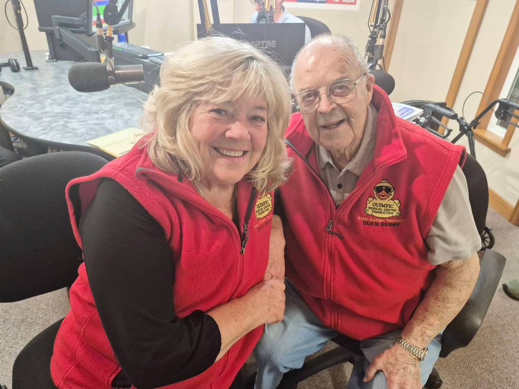 Gail Ralston and Howard Scooter Chapman grin after Chapman bought from her the ticket that created a new record for lifetime sales of tickets for the Olympic Medical Center Foundations Great Olympic Peninsula Duck Derby. This years derby is on Sunday. (Leah Leach/for Peninsula Daily News)