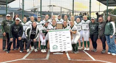 The Port Angeles softball team celebrates winning the District 3 2A tournament Saturday evening in Lacey, beating league rival North Kitsap 10-8 to win the title. The Roughriders will now move on the 2A state tournament in Selah.
