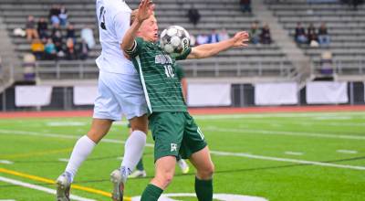 Port Angeles Matthew Miller battles a Steilacoom player in the District 3 2A tournament Saturday in Poulsbo. Steilacoom won 1-0 to end Port Angeles season with a 15-4-0 record. (Jay Cline/for Peninsula Daily News)