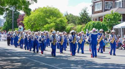 The Chimacum High School marching band marches along Lawrence Street in Port Townsend during the 91st Rhododendron Parade on Saturday. The band will play in Washington, D.C., during the Fourth of July parade to celebrate the 250th birthday of the United States. (Steve Mullensky/for Peninsula Daily News)