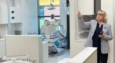 Paula Watson, director of Peninsula Colleges dental hygiene program, shows visitors the schools nearly completed dental clinic, where the first cohort of 10 students will begin learning radiology, digital imaging, teeth cleaning and other preventive dental care as part of the new program that will launch this fall. The college developed the program with significant financial support from U.S. Sen. Patty Murray, D-Seattle, and from Delta Dental of Washington to help workforce shortages and address gaps in dental care. (Paula Hunt/Peninsula Daily News)