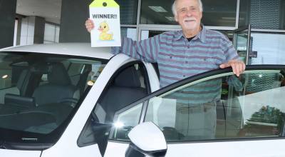 Walter Trial, 79, of Sequim, picks up his new Toyota Corrolla at the Wilder Toyota Showroom on Tuesday after his duck was selected for the top prize during the 37th annual Great Olympic Peninsula Duck Derby. (Dave Logan/for Peninsula Daily News)
