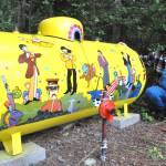 Matthew Nash/Olympic Peninsula News Group
Monika Livingstone of Gardiner kneels by the propane tank she spent about a month designing and painting after she was inspired by The Beatles Yellow Submarine.