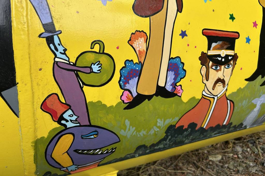 The Beatles, Sgt. Peppers Lonely Hearts Club Band, the Blue Meanies and many other characters make appearances on Monika Livingstones Yellow Submarine mural on her propane tank. (Matthew Nash/Olympic Peninsula News Group)