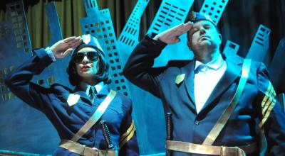 Officer Barrel (Shahida Shahir) and Officer Lockstock (Kyle LeMaire) patrol Urinetown as its top cops. (Matthew Nash/Olympic Peninsula News Group)