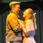 Hayden Pomeroy and Sunshine Peterson, as Bobby and Hope, embrace during a musical number in Urinetown the Musical. (Matthew Nash/Olympic Peninsula News Group)