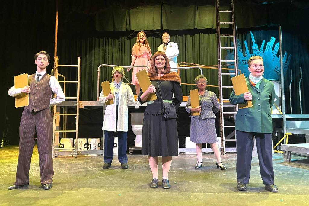 Matthew Nash/Olympic Peninsula News Group
Actors with Urinetown the Musical rehearse the song Mr. Cladwell. They include, from front left, Charlie Medlong (as McQueen), Nikki Forrest (Dr. Billeaux), Rebecca Maberry (Ms. Millennium), Fey Beeson (Secretary), Joodie Klinke (Senator Fipp), and, top left, Sunshine Peterson (Hope) and Ron Graham (Caldwell B. Cladwell).