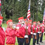 Taps is played by Kathy Nicholls of the Marine Corps League #897 at the conclusion of the Memorial Day Ceremony on Monday at Mount Angeles Memorial Park. An echo was played by the American Legion Post #29. (Dave Logan/for Peninsula Daily News)
