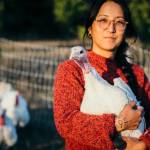 Mollayo Farm owner-operator TK Trocano holding a turkey. (Fiona Holden)