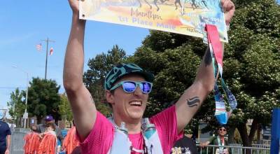 The men's winner of the North Olympic Discovery Marathon Alexander Roederer of Seattle celebrates his victory at the finish line. (Dave Logan/for Peninsula Daily News)