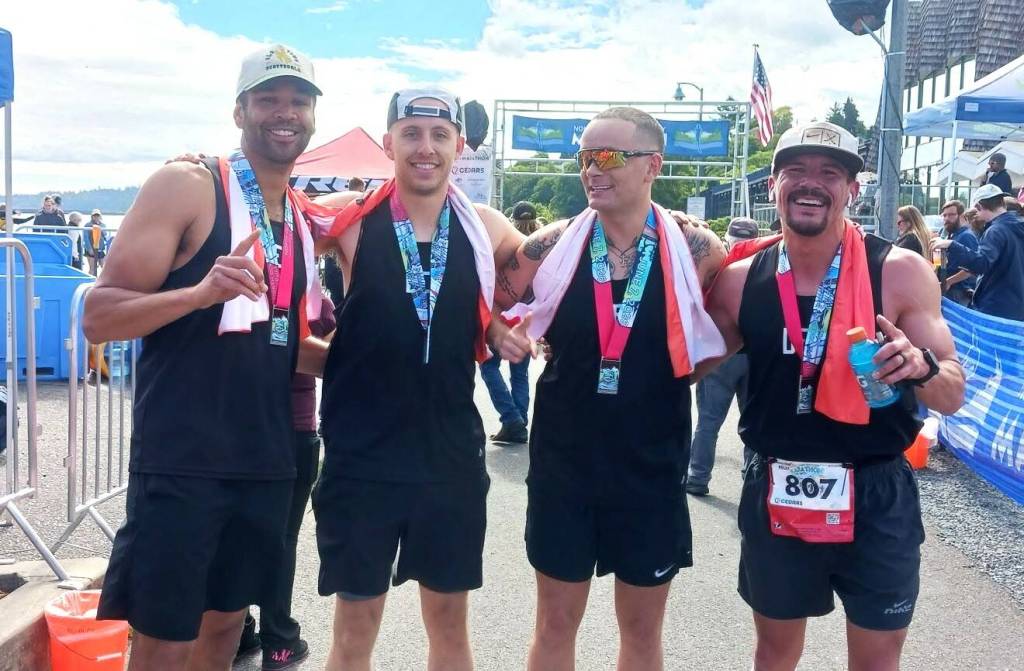 Team DEI from Alaska won the team marathon at the NODM on Sunday, actually beating the individual marathon winner. From left are team members Shaq Odom, Tom Baillie, John Haley and Jacob Parisien. (Pierre LaBossiere/Peninsula Daily News)
