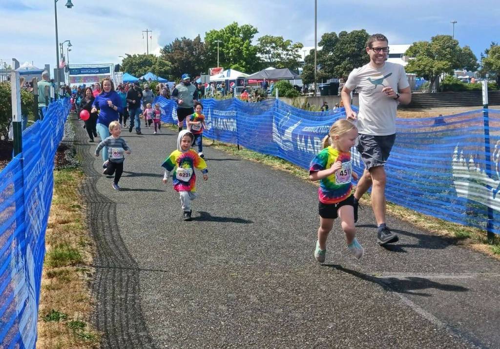 Kindergartners take off at the starting line in Saturdays NODM Kids Marathon (Pierre LaBossiere/Peninsula Daily News)