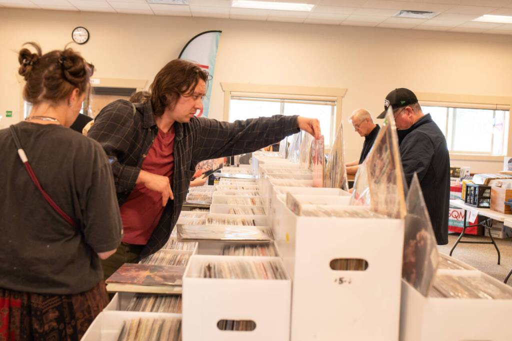 Sequim Gazette photo by Monica Berkseth/ Miranda Knight-Miles, left, and Andy Jauhola, both of Port Townsend, were among those who perused records at Saturdays fourth annual Sequim Record Show.