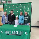 Port Angeles Matthew Miller signed to play college soccer for Bellevue College in a ceremony held Wednesday at Port Angeles High School. Miller seated, is joined by, from left, grandmother Janet Estes, father Michael Miller, Matthew Miller, mom Amber Miller and grandfather Arthur Estes.