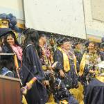 The Forks High School Class of 2026 begins to celebrate at the conclusion of the commencement ceremony on Saturday in the Spartan Gym. (Lonnie Archibald/for Peninsula Daily News)