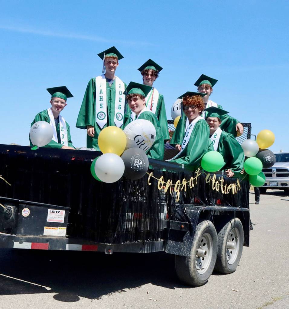 From left, front row, are Easton Dumbre, Killian Waknitz, Braeden Baker and Julian Smith, Port Angeles High School seniors who participated in a parade on Friday in downtown Port Angeles. Standing, from left, are Grant Butterworth, Andre Campbell and Gryphon Shields. (Dave Logan/for Peninsula Daily News)