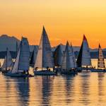 Some of the 70 entrants in the 10th Race 2 Alaska sail out of Port Townsend Bay, passing Mount Baker as they head to Victoria, B.C., for the first leg of the 750 mile race to Ketchikan, Alaska, at the 5 a.m. starting gun. The racers have 72 hours to make their way to Victoria, B.C., before a restart at noon on Thursday to complete the remaining 710 miles to Ketchikan. The rules of the race are that your boat cant have an engine, no pre-positioning of supplies and no set course. Any rescue would be hours away. (Steve Mullensky/for Peninsula Daily News)