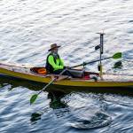 Lillian Kuehl, from Port Angeles, the only entrant out of 70 from the North Olympic Peninsula, rows her way out of Port Townsend Bay at the 5 a.m. starting gun and into the Salish Sea during the first 40 miles of the 750-mile 10th Race 2 Alaska on Sunday. (Steve Mullensky/for Peninsula Daily News)