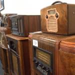 Classic radios line the walls of KSQM 91.5 FMs meeting space. (Matthew Nash/Olympic Peninsula News Group)