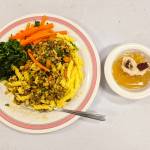 Tempeh bolognese is served over gluten-free pasta with greens, carrots and Japanese kanten during one of the Together Around Food meals. (Sailesh Rao/Together Around Food)