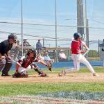 Wilder Seniors Easton Fisher takes a big cut at a pitch against the WBS Colts Black squad Sunday at Civic Field. Fisher had the game-winning hit against the Colts Black.