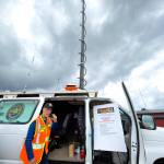 Mark Miller, with Jefferson County Volunteer Emergency Communicators, makes a call from the broadcast van owned by Jefferson County that would be used in remote locations in the event of a major emergency. The radios 40-foot antenna can broadcast to every area of Jefferson County, including the West End, with a repeater to boost the signal. (Steve Mullensky/for Peninsula Daily News)