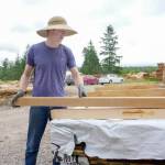 Tate Munnich, a worker at the Jefferson Timber Cooperative, prepares a pallet of cedar for shipping to Sustainable Northwest in Seattle. (Steve Mullensky/for Peninsula Daily News)
