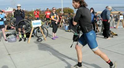 (File photo by KEITH THORPE/PENINSULA DAILY NEWS) Big Hurt iron man competitor Joey Gish of Sequim races through the transfer zone on the way to his kayak after finishing the mountain bike leg of the race in first place in September 2025 at Pebble Beach Park in Port Angeles. Gish finished second to Michael Finley, who won the race for the fourth time.