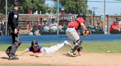 The Lefties Sam Matosich slides safely home Sunday on a hit-and-run play at Civic Field against the Kamloops NorthPaws. (Dave Logan/for Peninsula Daily News)