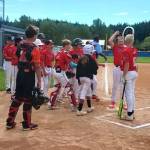 Wilder 12Us Mason Henderson is greeted at home plate by his teammates after belting a home run against Silverdale at Lincoln Park on Saturday in the Cal Ripken Northwestern Washington state tournament. Silverdale was able to hold on to win 4-1. (Pierre LaBossiere/Peninsula Daily News)
