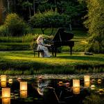 Jennifer Thomas, performing for her music video Etude for the Dreamer in 2022 at Nelsons Duckpond & Lavender Farm, will perform her first outdoor concert at the farms pond on Aug. 8. Tickets for the one-night-only concert are at https://jenniferthomasmusic.com/pages/concerts. Sequim artist Ryan Stewart also will perform. (Jennifer Thomas)