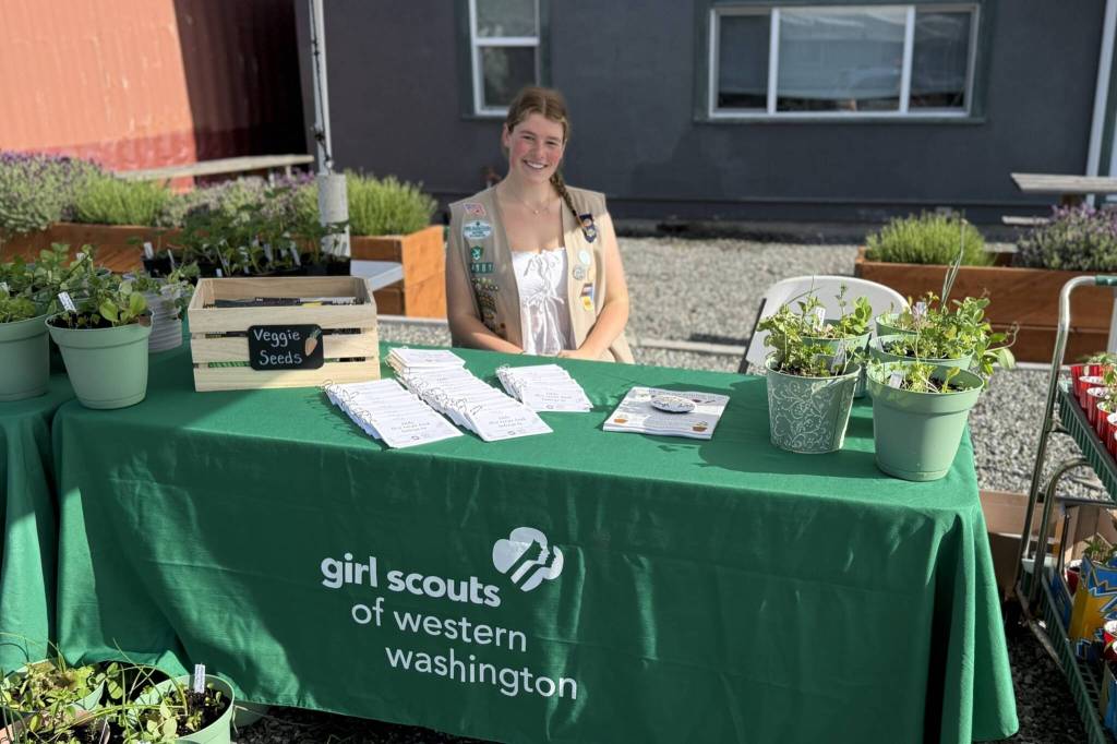 As part of one of three events for her Girl Scout Gold Award project, Skylar Krzyworz provided 100 one-pot gardens, 200 low-cost recipe books, seed packets and plant starts at the Sequim Food Bank last summer. (Skylar Krzyworz)