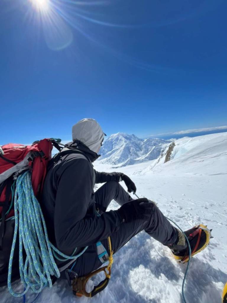 Paul Balkan takes a break at West Buttress Ridge at about 16,000 feet. (Paul Balkan)