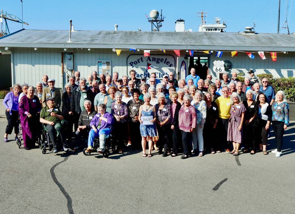 The Port Angeles High School Class of 1966 recently held its 60th reunion. The 75 classmates gathered at the Port Angeles Yacht Club with a Route 66 theme. The class is best remembered for its winning basketball team. Led by seniors Mike Clayton, Greg Kushman and Leroy Sinnes, the team reached the state championship game but finished second after a 62-46 loss to Renton. The reunion was organized by Bruce Skinner, who was the basketball teams manager at the time. (Dave Logan/for Peninsula Daily News)