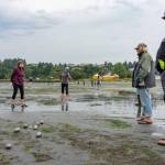 Members of the Port Townsend Pétanque Club play an end during the clubs annual Low Tide Open tournament on the beach at the Port Townsend Boat Haven. Tossing the boule is Port Ludlows Barb Phillips with teammate Rhonda Lauth, left. Watching are Robert Force and Dave Robison, both of Port Townsend. Force is credited with introducing pétanque to Port Townsend in 2018. (Steve Mullensky/for Peninsula Daily News)