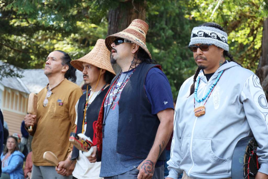 Wade Greene, left, Randy Eastman Jr., Mike Ward and Randy Jackson Jr. sing a blessing song Thursday at the NatureBridge Campus. (Emily Hanson/Peninsula Daily News)