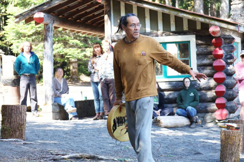 Wade Greene speaks Thursday about canoes that were carved at the NatureBridge Campus. (Emily Hanson/Peninsula Daily News)