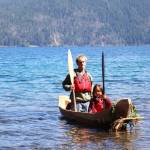 Landon Eastman, left, and JeDiyah Jackson approach the shore of Lake Crescent in Bear Shadow on Thursday at the NatureBridge Campus. (Emily Hanson/Peninsula Daily News)