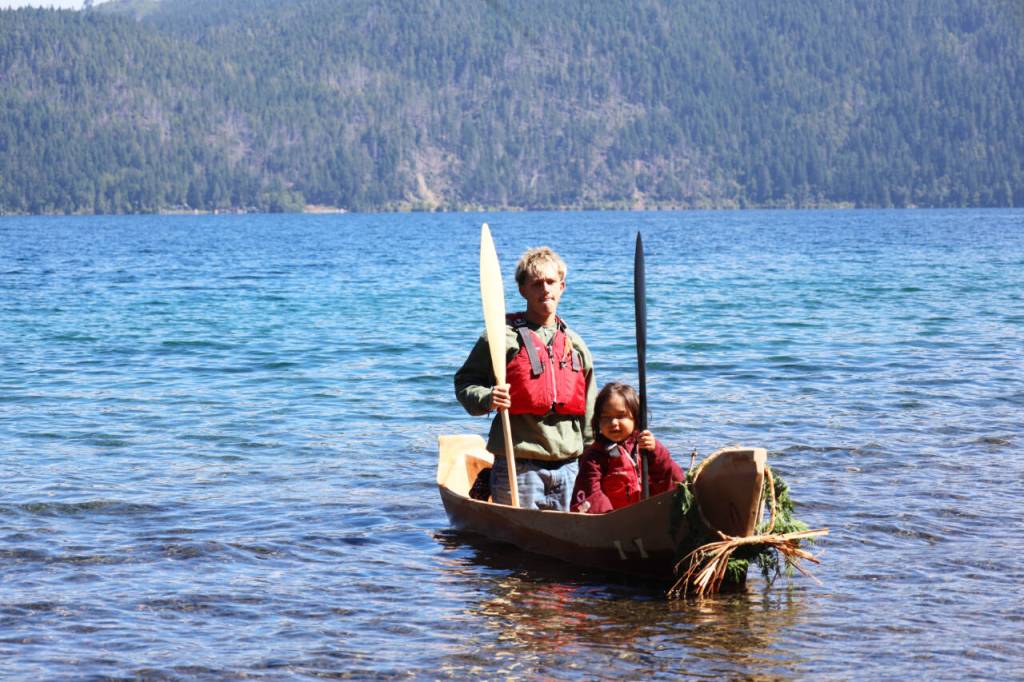 Landon Eastman, left, and JeDiyah Jackson approach the shore of Lake Crescent in Bear Shadow on Thursday at the NatureBridge Campus. (Emily Hanson/Peninsula Daily News)