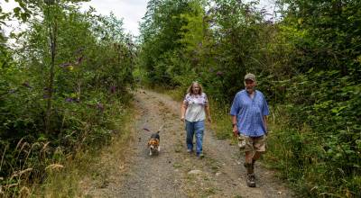 Dave and Lynda Breithaupt walk with their dog Lily on the Dungeness Trails where Dave and Lily encountered a cougar on two consecutive days last month. Experts estimate there are about 300 cougars on the Olympic Peninsula. (Tom Buscher/Olympic Peninsula News Group)