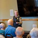 Sequim Police Officer Roderic Sisk was part of a three-person law enforcement panel that advised seniors at The Lodge about red flags that indicate a scam. (Tom Buscher/Olympic Peninsula News Group)